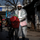 A woman in Wuhan, the provincial capital where the virus was first detected, goes out on Feb. 9.